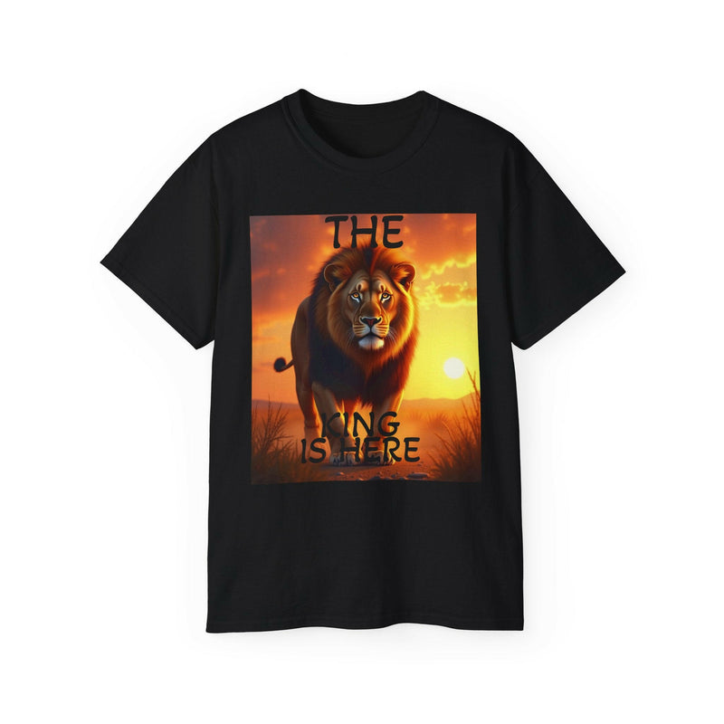 Black unisex ultra cotton tee featuring a bold Lion King graphic with sunset background and "The King is Here" text.
