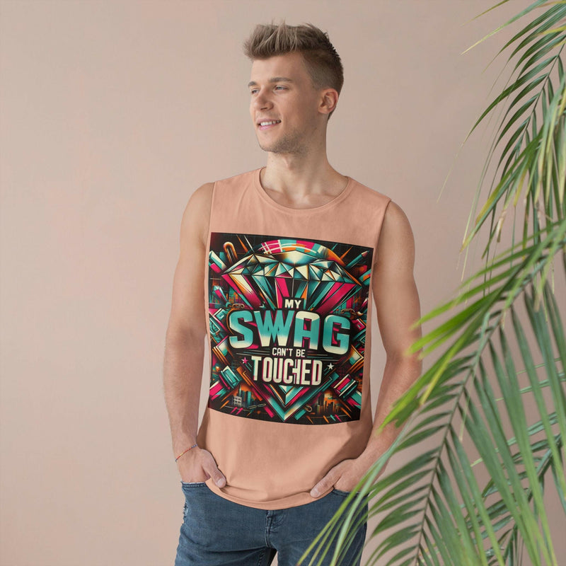 Man wearing a peach unisex graphic tank top with a colorful "My Swag Can't Be Touched" design, styled for casual summer wear.