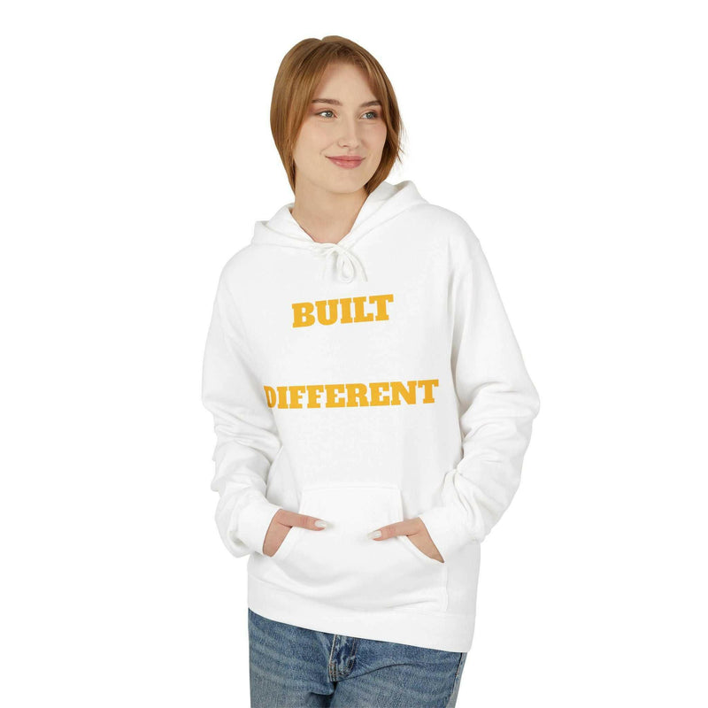 Unisex white hoodie with "Built Different" yellow text, soft fleece, relaxed fit, and pouch pocket.