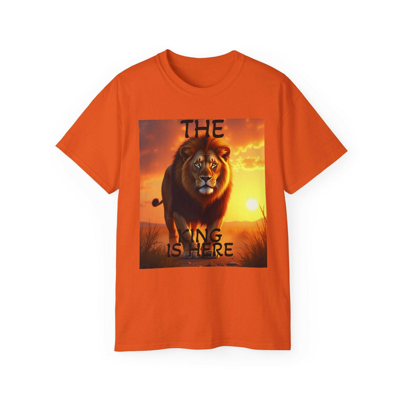 Orange unisex ultra cotton tee featuring a bold lion graphic with "The King Is Here" text and a sunset background.