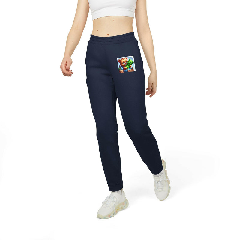 cozy unisex fleece joggers in navy blue with elastic waistband and cuffed hems, featuring slanted side pockets and a colorful graphic patch, worn for casual and loungewear use